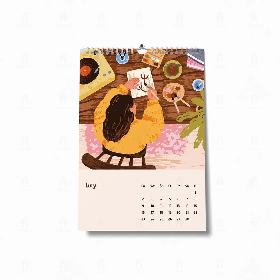  ilustracja przedstawia artystkę w jej pracowni, malującą akwarelami przy dźwiękach muzyki z gramofonu. 